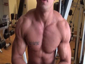 Young Muscle Guy pumps up chest