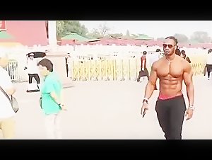 The American fitness Model Ulisses jr Walks on the street shirtless.