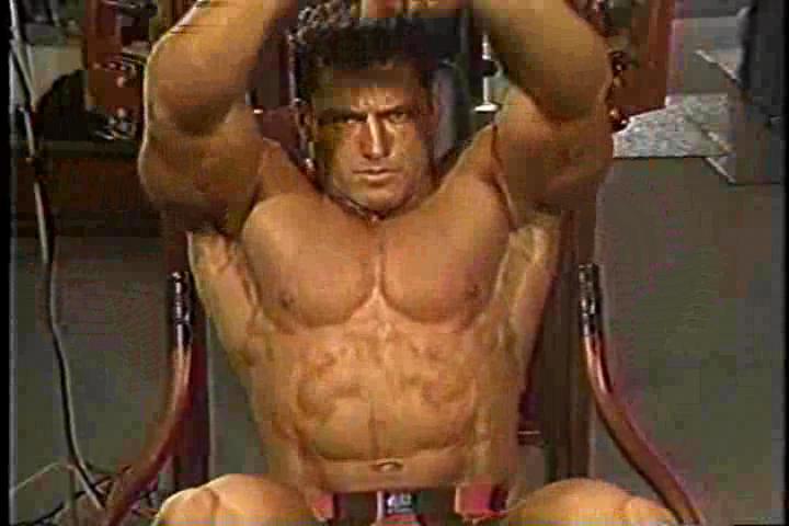 Dennis Newman flexing pecs