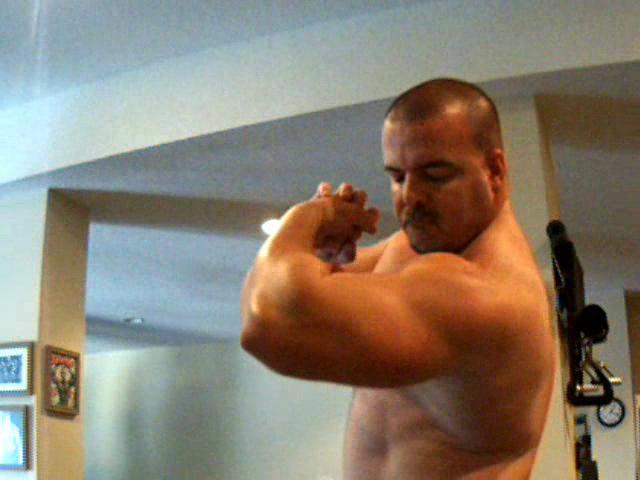oiled up and flexing