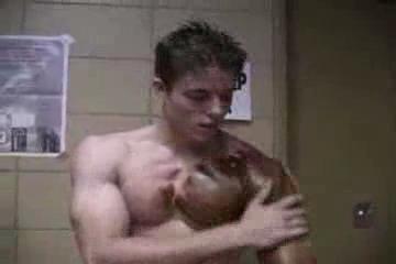 Muscle Stud Putting on Bronzer