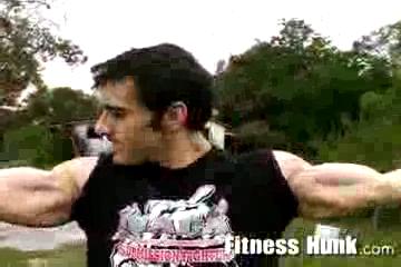 Tony flexing outdoors