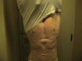 Ripped teen posing in hotel room