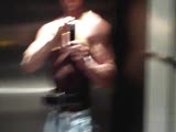 posing in an elevator
