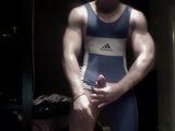 muscle stud wrestler in a singlet jacks off