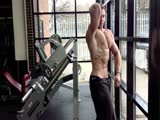 Adam Charlton flexing