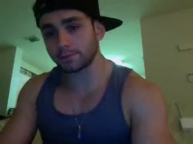 muscle guy stroking his cock