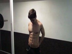 cocky muscle guy posing in the gym