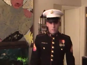 Hot Marine cleaning his rifle.