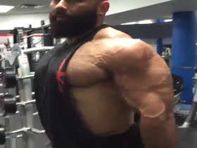 Jason pumping biceps