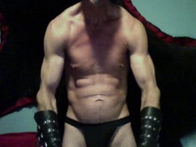Cocky leather biceps flex