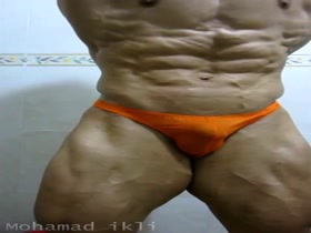 BIG BODYBUILDER MOHAMAD IKLI POSING & FLEXING IN ORANGE POSERS