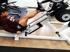 Young athlete Tomas pressing his legs