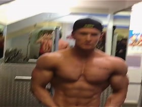 Zac Aysnley posing in gym after his first contest