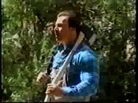 Lumberjack strips down in woods