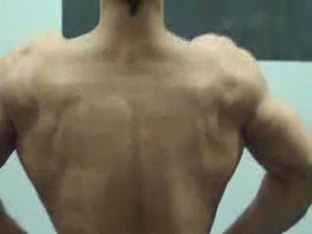 Teen bodybuilder gym posing