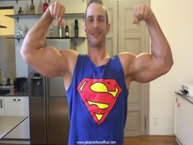 Jakub Stefano Flexing In Superman Tank Top