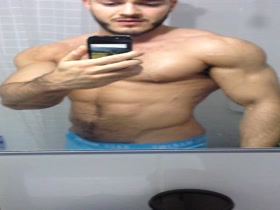 Ripped muscle freak hairy stud before bodybuilding show