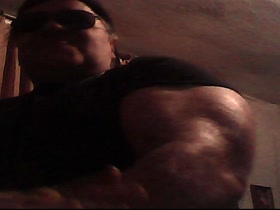 Massive Biceps in tight T-Shirt