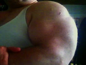 Massive Biceps in Undershirt (close up)