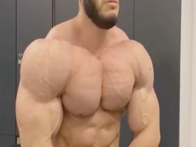 massive guy jerks after flexing