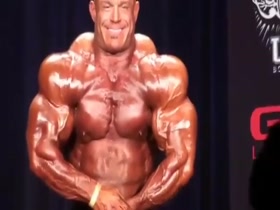 Jon flexing hard and looking massive and veiny