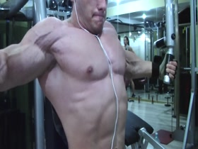 Young Hercules trains his chest and poses