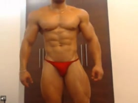 Stunning Latin Muscle Hunk - in the tiniest red posers
