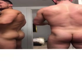 2 fit guys wearing just pants and taking turns showing us what they've got.