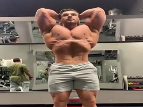 Dmitry posing and flexing