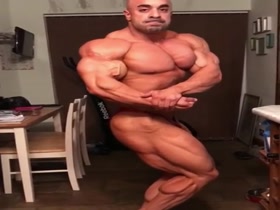 Huge Muscle Hunk Flexing in Tiny Briefs