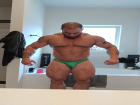 Caleb Blanchard green skimpy posing suit