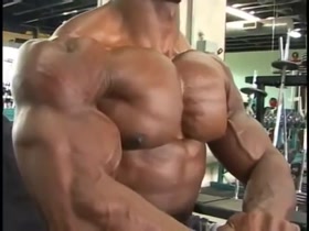 Flexing and Squeezing his Huge Pecs