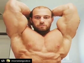 Flexing his hot huge pecs