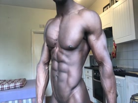 Daniel flexing his cut and shredded body