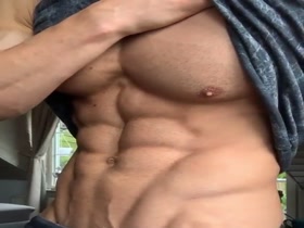 Showing what he's got under his shirt