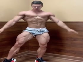 Glasses and Muscles - young hunk flexing