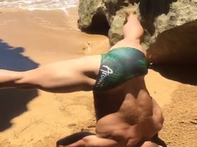 Hot bodybuilder on the beach