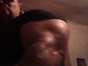 Massive Biceps in T-Shirt in the Dark