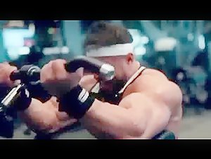 Grunting roided bodybuilder grinds out reps