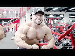 vascular giant Mohammed poses n pumps