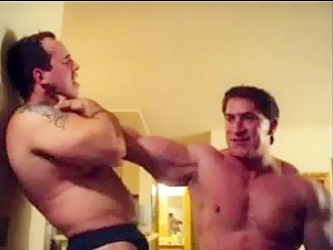 Bodybuilder dominates small man