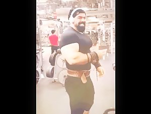 Massive strongman flexing