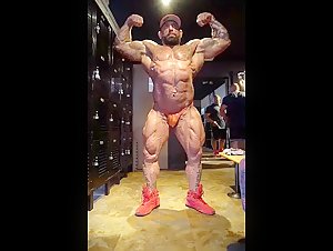 Bodybuilder Posing in locker room