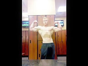 Hot blonde hunk flexing