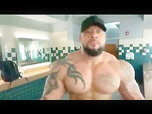 tattoed bodybuilder flexing