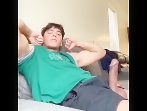 Young jock flexes his biceps with his big dick out