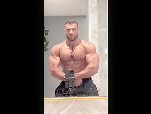 Bodybuilder Posing In The Mirror