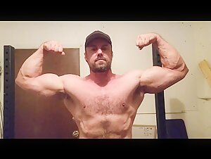 Dan Lang flexes biceps