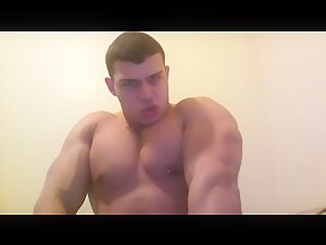 Massive alpha bodybuilder flexes and jerks his cock